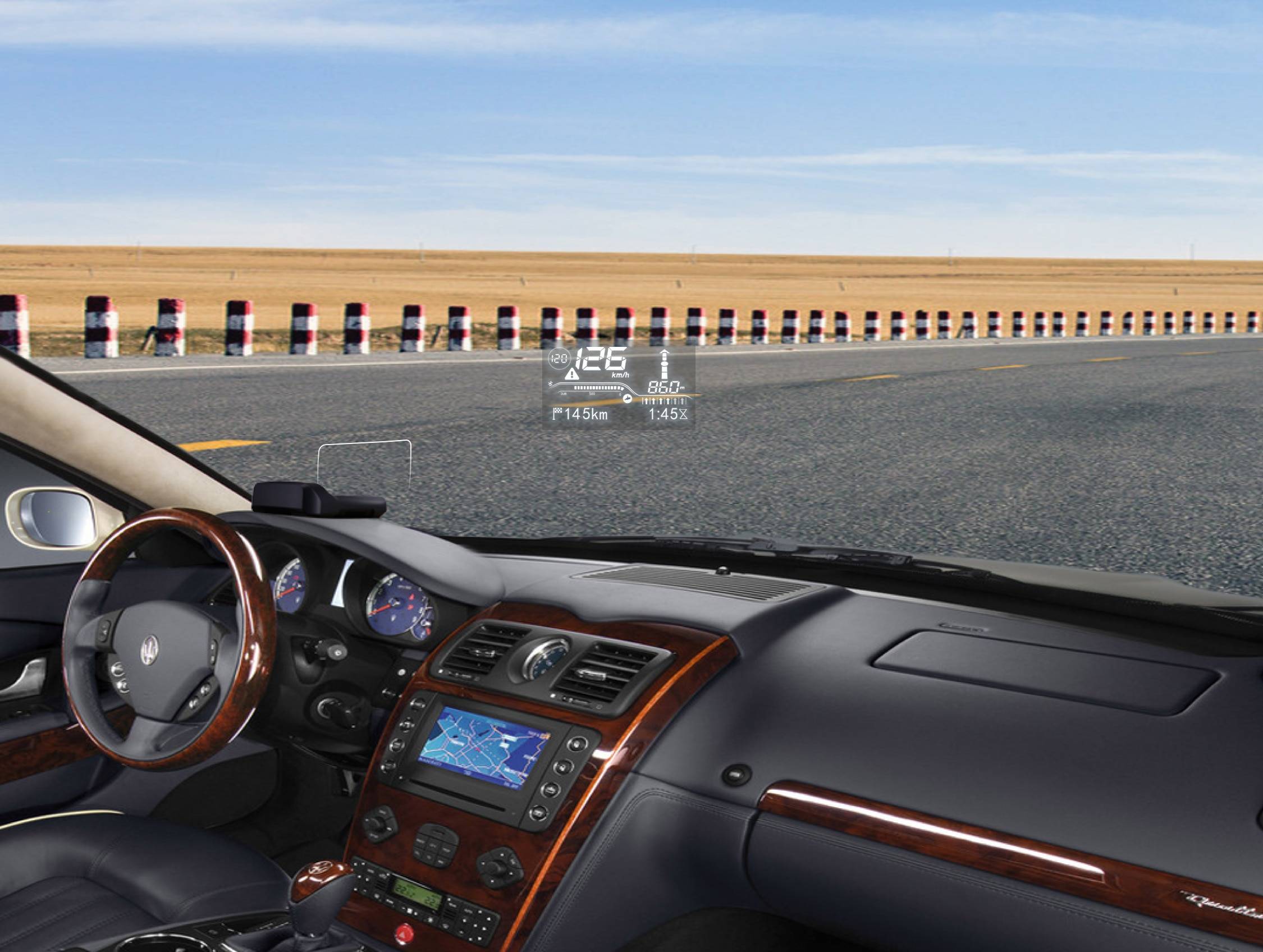 Smart mini HUD installed on a car dashboard showing voltage and speed
