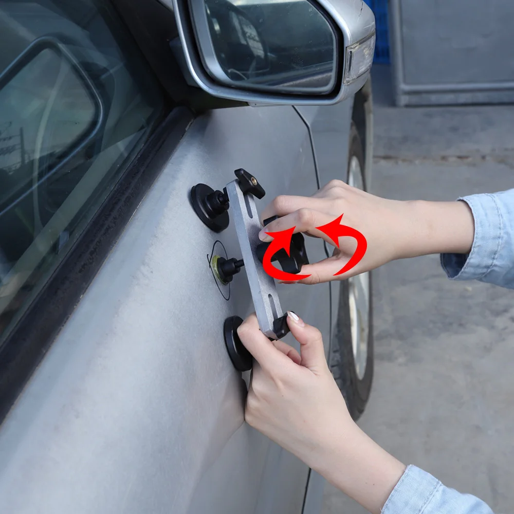 Multiple Suction Cups Multiple suction cups attached to a car body panel