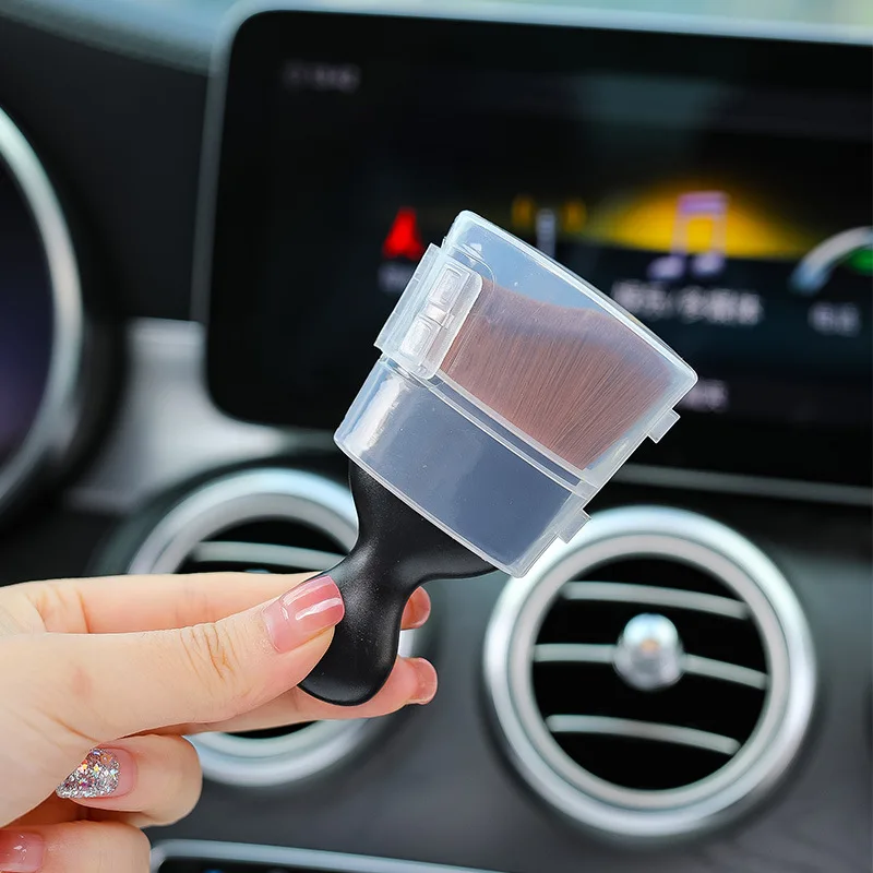 Cleaning dashboard air vents with ultra-soft detailing brush