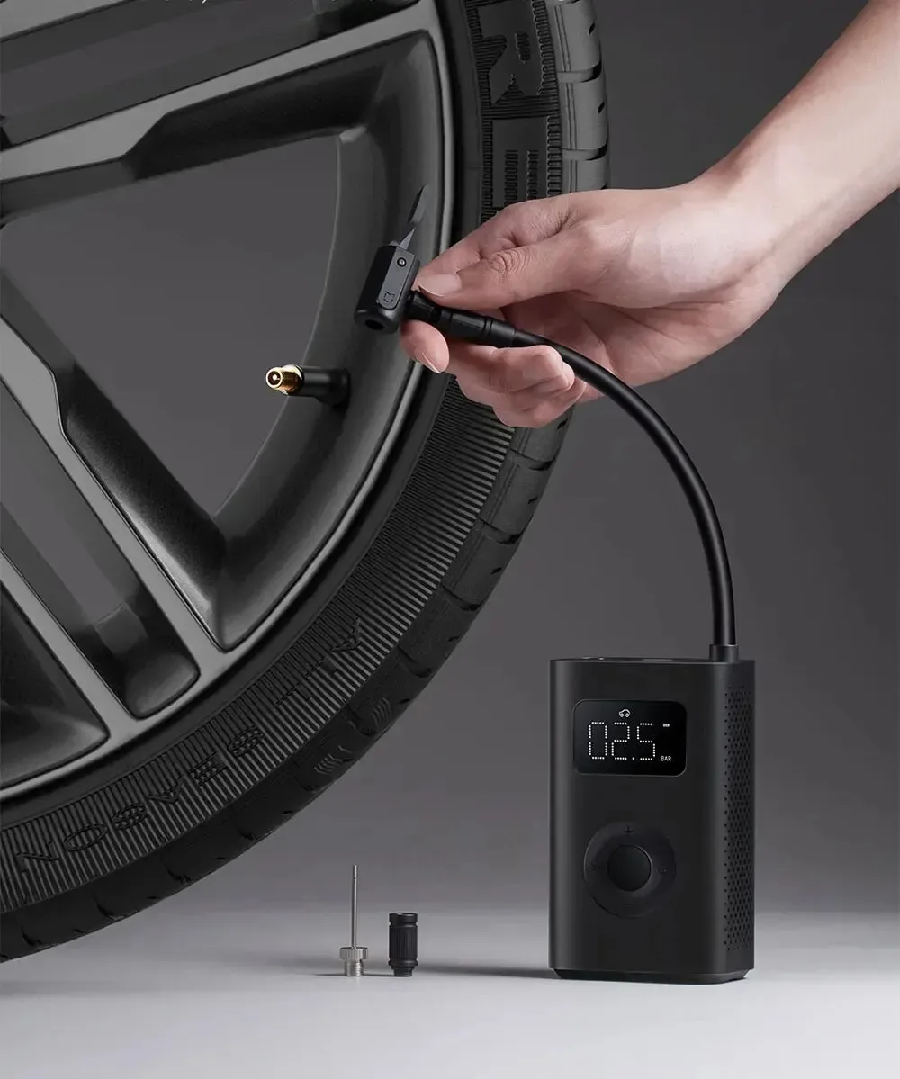Air compressor pump stored in car glove box for emergencies
