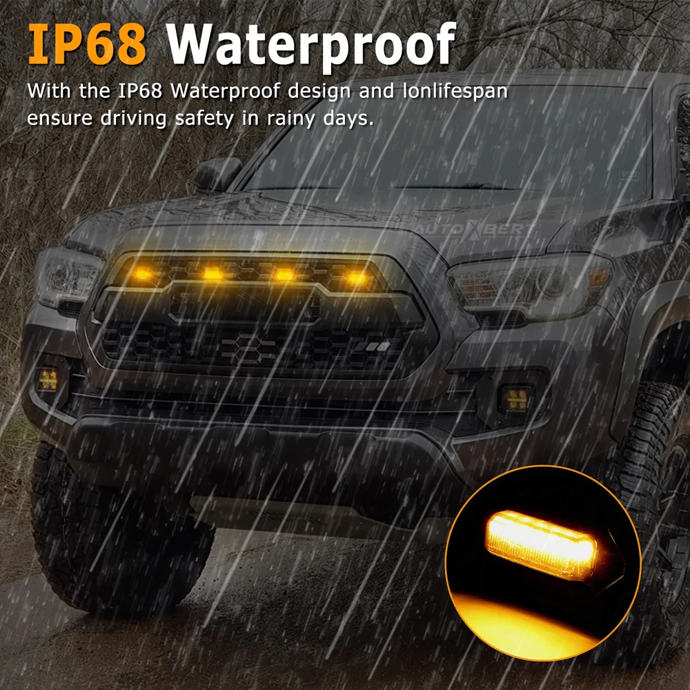 Close view of amber LED Raptor Lights in a Toyota Tacoma grille